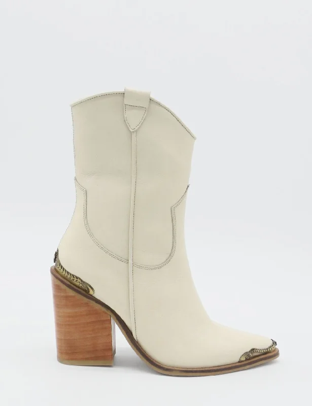 Men's western boots with a concho - studded strap and a pointed toeCoachella western cowboy boots in off white leather womens shoes